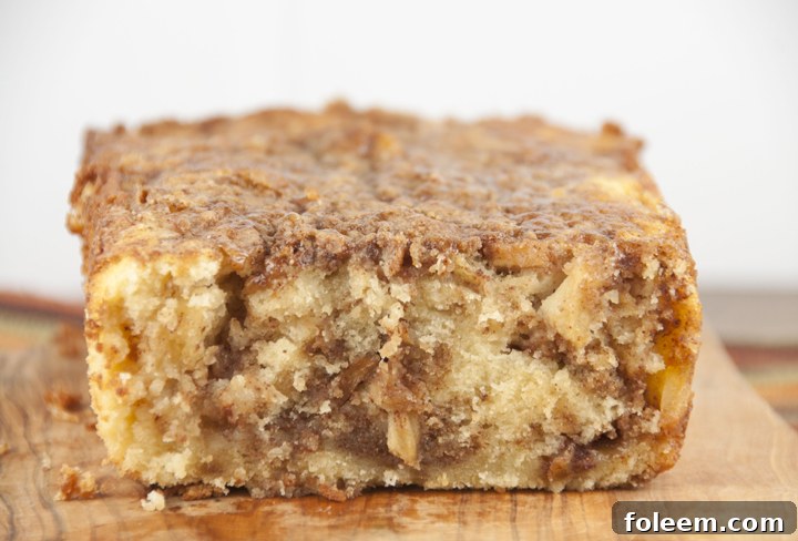 A warm loaf of Cinnamon Apple Pie Bread, resembling apple pie in bread form, perfect for fall.