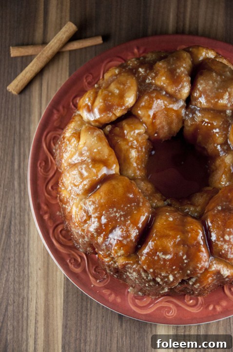 Delicious cinnamon pull-apart bread, also known as monkey bread, with a sweet vanilla maple glaze.