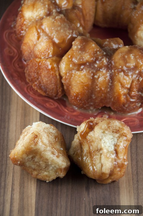 An easy recipe for homemade cinnamon monkey bread, glistening with a warm vanilla maple glaze.