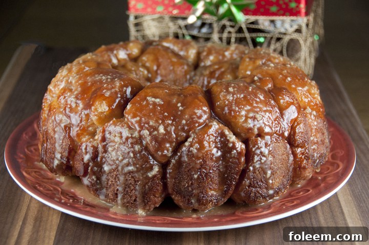 Close-up of cinnamon pull-apart bread with vanilla maple glaze, perfect for holiday breakfast.