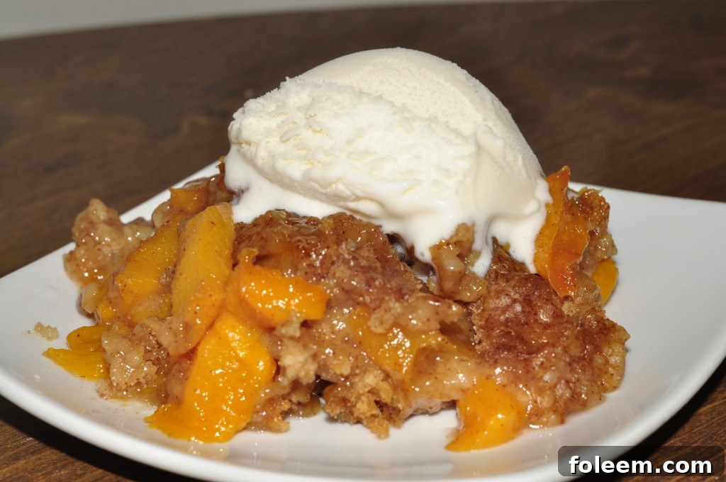 Crock Pot or Slow Cooker Peach Cobbler dessert recipe is best served warm and topped with vanilla ice cream. It's an easy dessert to throw in the crock pot and just let it cook.