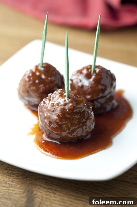 Crock Pot Grape Jelly BBQ Cocktail Meatballs appetizer recipe for holiday entertaining, Super Bowl party, or pot luck made right in the slow cooker.
