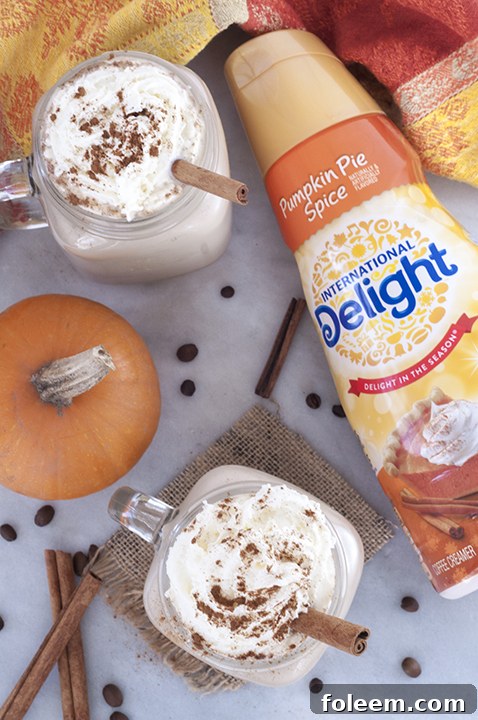 Easy Slow Cooker Pumpkin Spice Lattes for a crowd is the perfect recipe for a fall holiday party or a cozy gathering.
