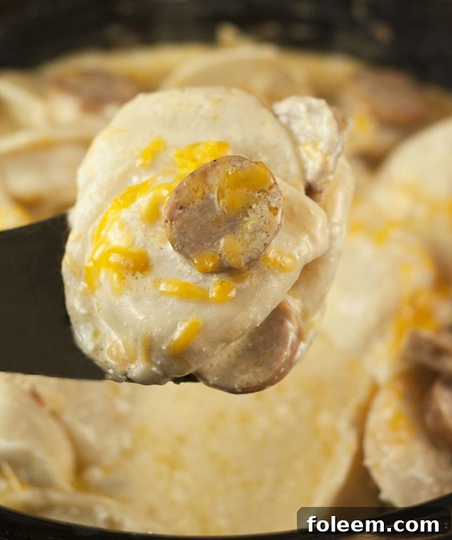 Easy Crock Pot Sausage Pierogi Casserole recipe is a delicious and comfort food dish made with chicken sausage and a creamy cheese sauce. Great for potlucks or a weeknight meal cooked right in the slow cooker!