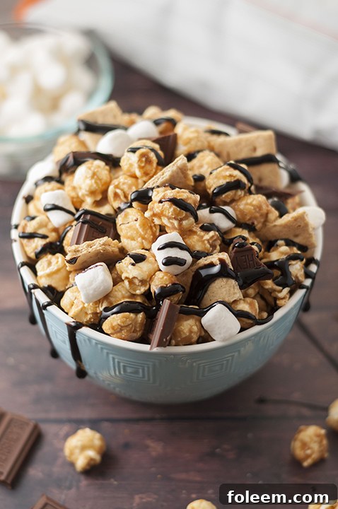 Caramel S'mores Popcorn recipe is the perfect movie night snack, made easy with store-bought caramel popcorn and a touch of s'mores magic!