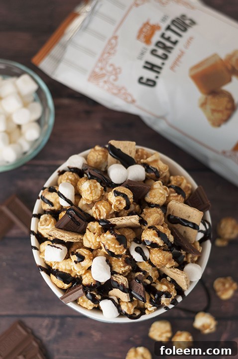 Caramel S'mores Popcorn snack recipe is the perfect movie night treat, elevated by using G.H. Cretors caramel popcorn for an unforgettable flavor experience!