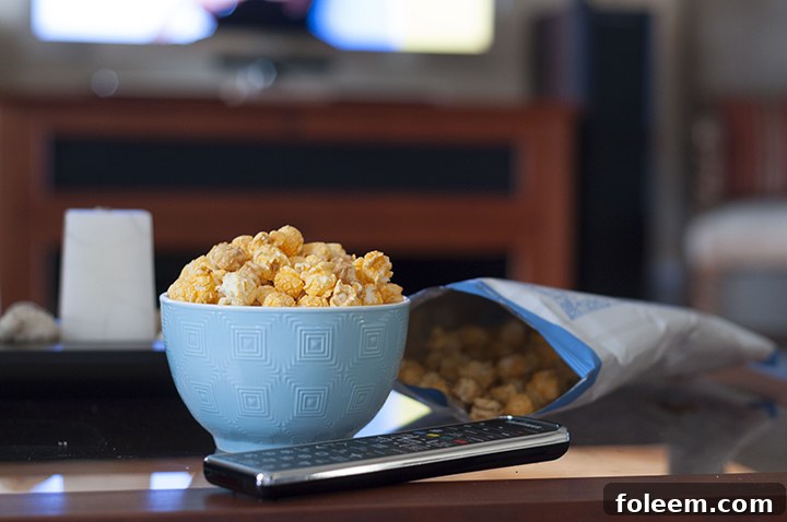 G.H. Cretors Chicago Mix Sweet and Salty popcorn, the ideal snack for a cozy movie night, offering gourmet taste and quality ingredients.