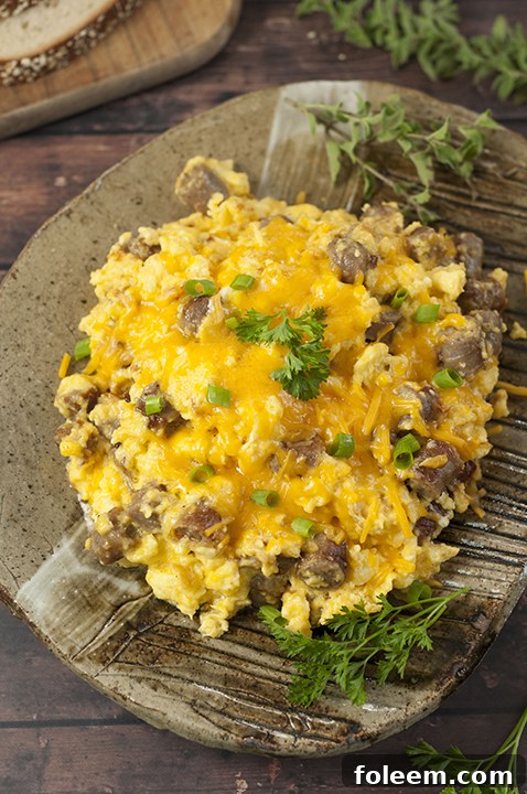 Close-up of a hearty Pork Sausage, Egg, and Cheese Scramble, ready to be served for breakfast, brunch, or dinner.