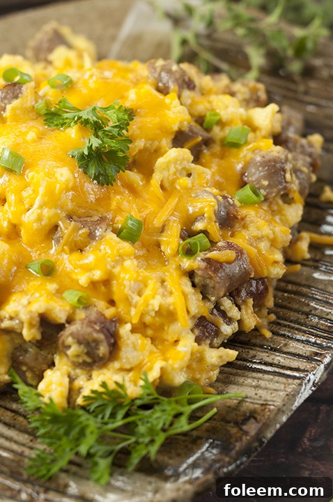 Easy and delicious Pork Breakfast Sausage, Egg, and Cheese Scramble recipe, an ideal hearty meal for any morning or evening.