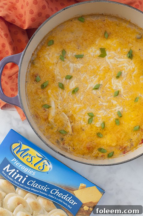 Cheesy Cajun Chicken Pierogy Bake Casserole Recipe is classic comfort food that will take your weeknight dinner to a whole new level. It is all made in one pot, complete with chicken and veggies!