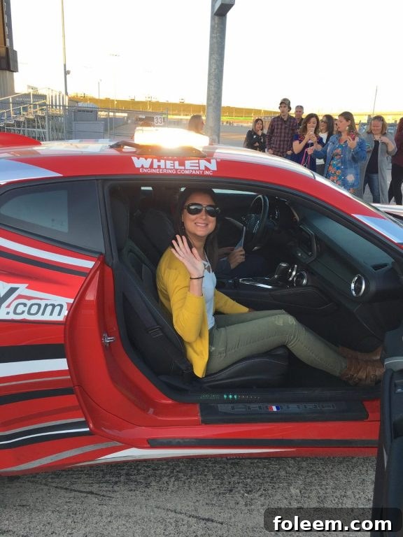 Excited and ready to take a ride in a real racecar at the Iowa Speedway.