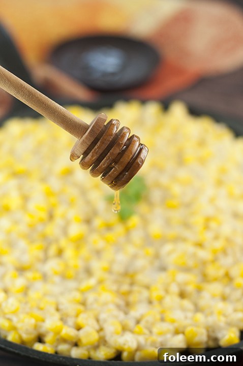 Close-up of Honey Butter Creamy Skillet Corn simmering in a skillet, perfect for Thanksgiving or Christmas