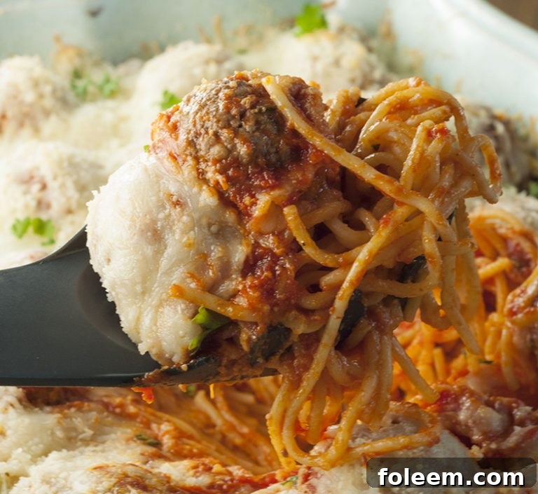 A serving of Italian Baked Spaghetti and Meatballs Casserole, perfect for any family dinner.