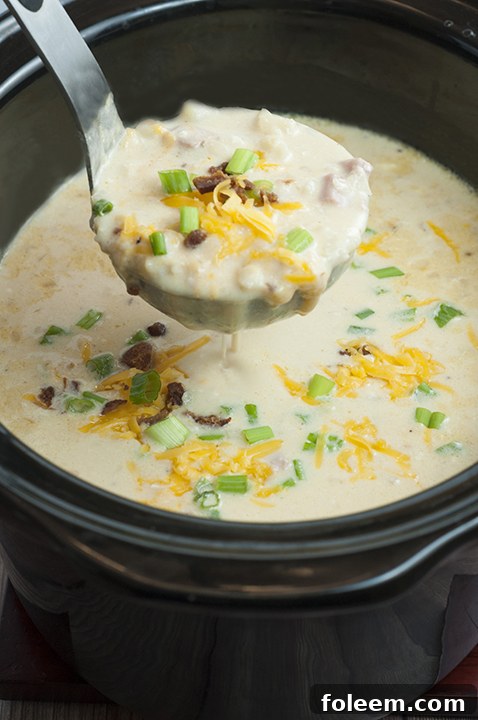 Ultimate Crock Pot Loaded Bacon Baked Potato Soup, perfect for cozy evenings or game day gatherings.