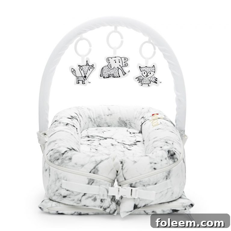 Deluxe Marble DockATot review for babies with toy arch and toy set.
