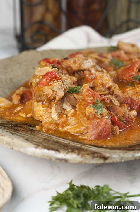 Hearty Chicken Cacciatore dish, perfect for an easy Italian night dinner served over pasta or rice.