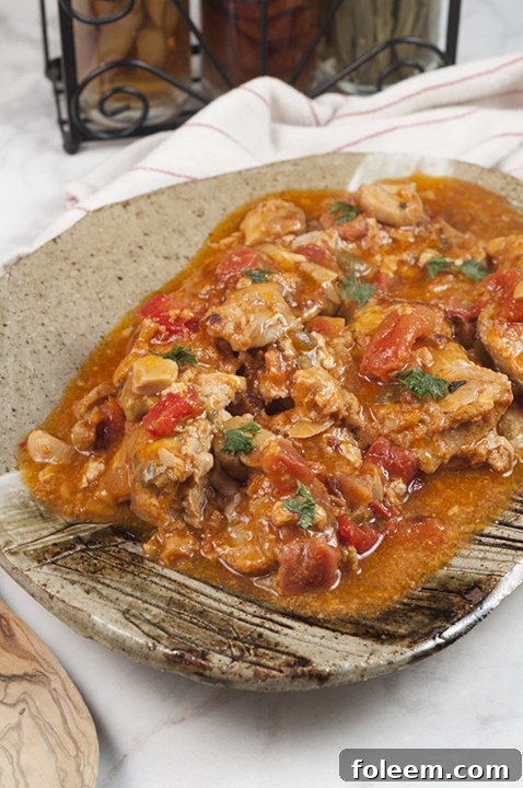 This hearty Chicken Cacciatore, easy to prepare and featuring a rich, thick broth, is ideal for an Italian night dinner with pasta or rice.