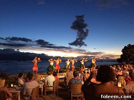 Graceful hula dancers performing at the Feast at Lele Luau in Maui, Hawaii.