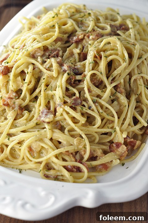 Authentic Italian Pasta Carbonara recipe exactly how they make it in Rome! The eggs give it the silky, creamy texture this pasta dish is known for without all of the heavy cream.