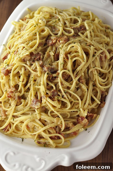 Authentic Italian Pasta Carbonara recipe exactly how they make it in Rome, Italy! The eggs give it the silky, creamy texture this pasta dish is known for without all of the heavy cream.