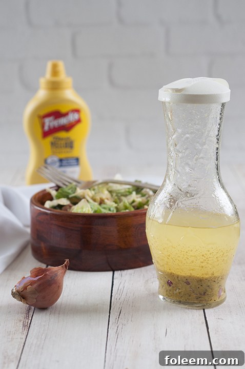 Simple Mustard Shallot Vinaigrette recipe that would go perfectly on any salad or pasta salad!