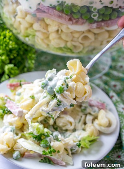 Make-ahead salad with ham and salami, ideal for picnics.