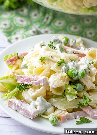 Beautiful make-ahead layered salad with cheese and parsley topping.