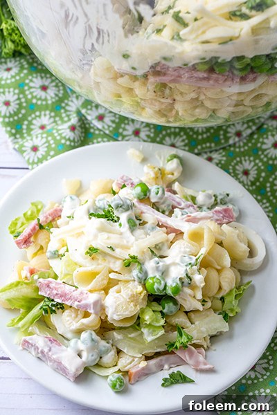 Top view of the make-ahead eight layer salad, garnished and ready.