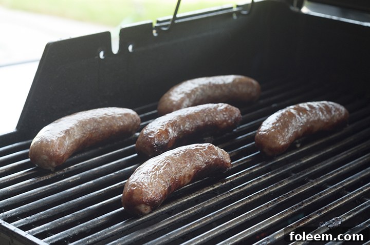 Grilled Beer Brats with fresh Mango Lime Salsa, perfect for summer cookouts.