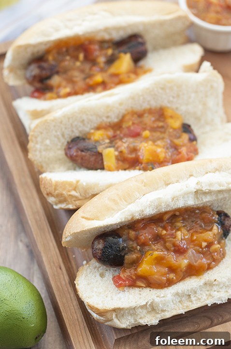 Flavorful Grilled Beer Brats with vibrant Mango Lime Salsa, a must-have for any summer BBQ.