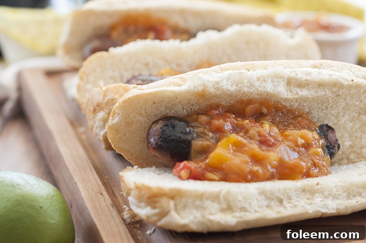Easy, tasty Grilled Beer Brats with Mango Lime Salsa is a hearty, delicious meal made right on the grill for 4th of July and all of those summer events!