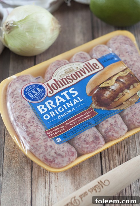 Juicy Johnsonville Original Brats on buns, topped with refreshing Mango Lime Salsa.