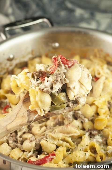 Close-up of Philly Cheesesteak Pasta, loaded with melted cheese, bell peppers, and savory beef.