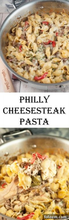 Philly Cheesesteak Pasta garnished with fresh parsley, ready to be served from a skillet.