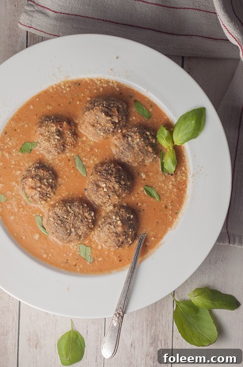 Tomato Basil Bisque with Italian Meatballs is a smooth, rich bisque or soup recipe for a comforting fall dinner idea!