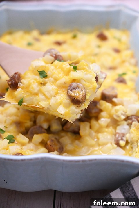 A close-up of the uncooked Cheesy Potato Sausage Breakfast Casserole before baking.