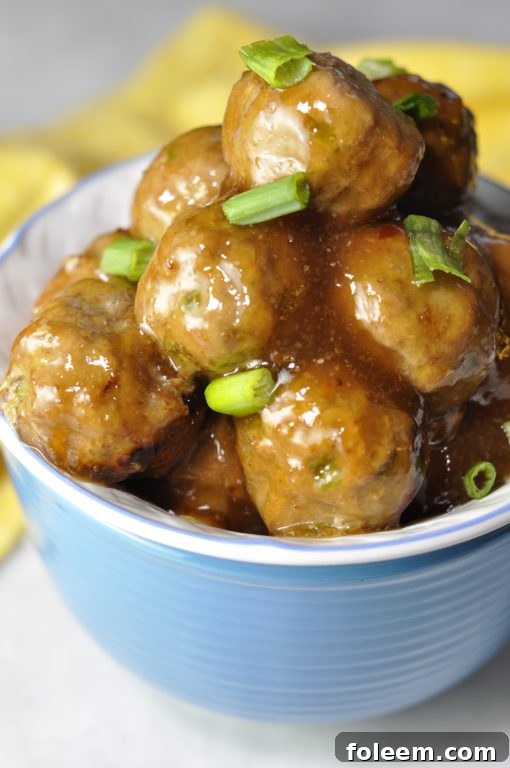 Easy Baked Orange Meatballs: a delicious dinner, appetizer, or game day snack with a sweet Asian glaze, perfect for feeding a crowd.