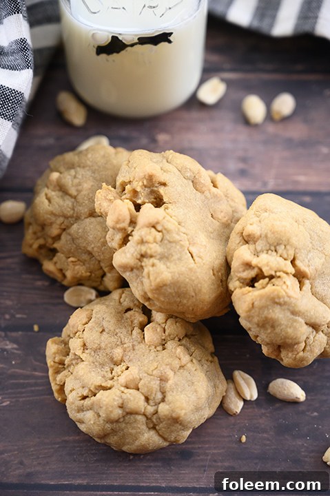 Deliciously easy thick and chewy bakery style double peanut butter cookies with a perfect gooey center, making them the only peanut butter cookie recipe you'll ever need for family and friends.