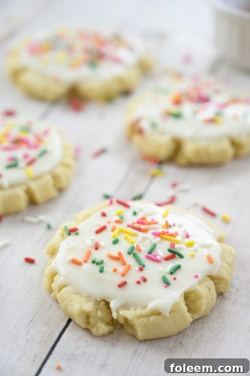 The very best Copycat Bakery Frosted Swig Sugar Cookies recipe - no chilling of the dough, rolling out the dough, or cutting them out with cookie cutters! These easy cookies are so soft, buttery, and so perfectly delicious!