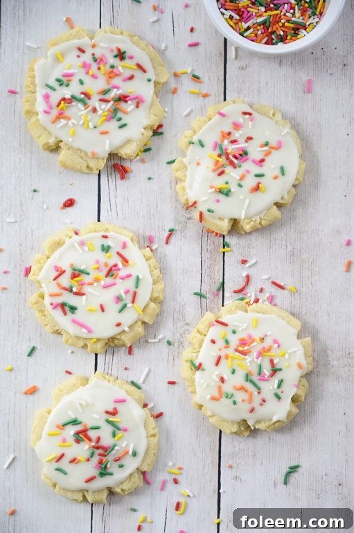 The absolute best Copycat Bakery Frosted Swig Sugar Cookies recipe - no chilling of the dough, rolling out the dough, or cutting them out with cookie cutters! These easy cookies are so soft, buttery, and so delicious!