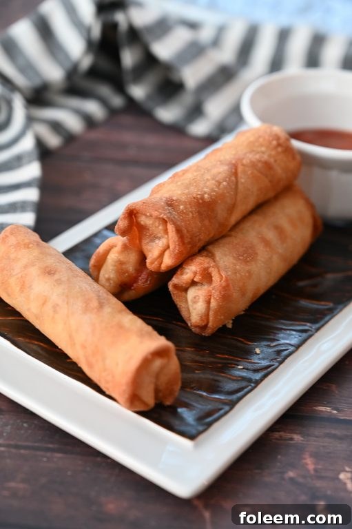 A plate of golden brown baked pizza rolls, perfect for sharing