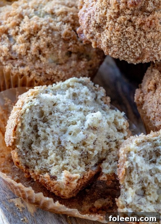 Seven delicious banana crumb muffins displayed on a white platter, ready for serving at any meal.