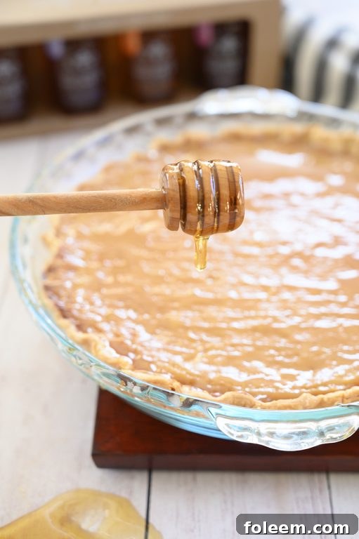 Overhead shot of Salted Honey Pie, showcasing its golden brown surface and the subtle texture of the custard