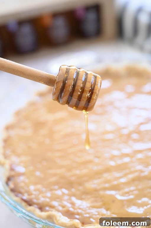 Beautifully baked Salted Honey Pie, showcasing a golden-brown, flaky, and buttery pie crust with a perfectly set custard filling, ready for slicing