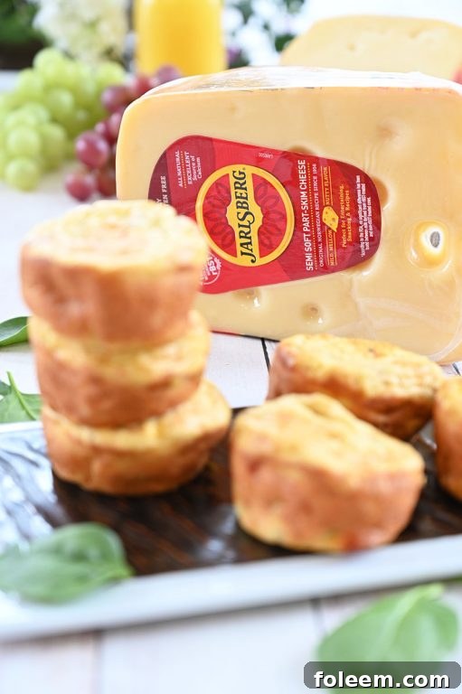 A vibrant breakfast spread featuring Mini Sausage, Spinach, and Jarlsberg Cheese Frittatas, ideal for a holiday brunch
