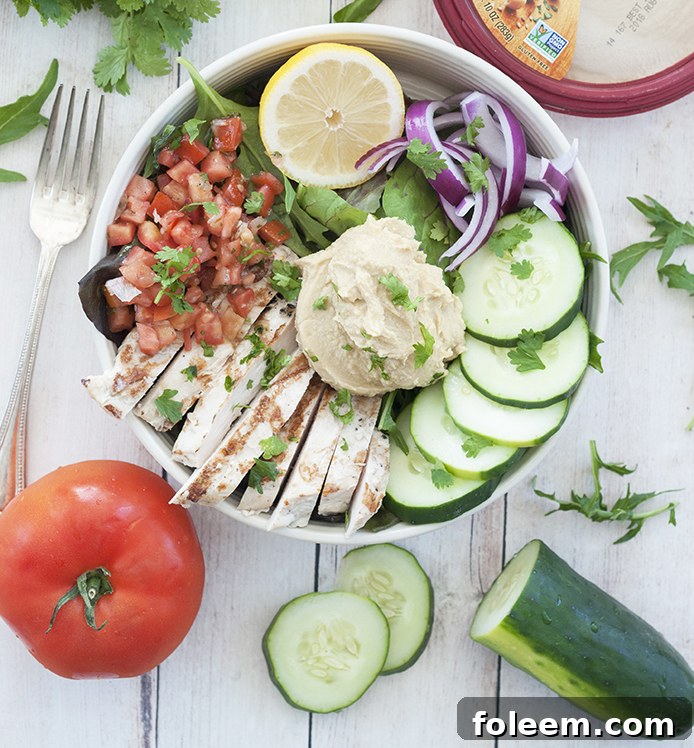 Power Chicken Hummus Bowl is both a salad and a hummus bowl and is a healthy Mediterranean-inspired recipe perfect for lunches or easy weeknight dinner!