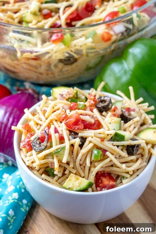 Easy side dish for potluck, California Spaghetti Salad with zucchini and fresh vegetables, tasting even better on the second day.