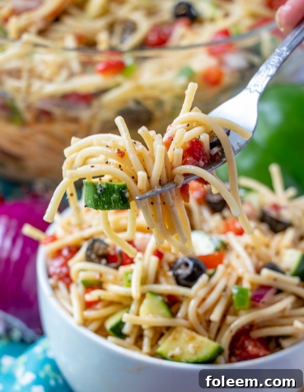 Refreshing summer salad recipe with fresh veggies like zucchini, California Spaghetti Salad is easy to make and perfect for picnics.