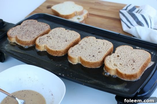 Cooking French Toast on a kitchen griddle.