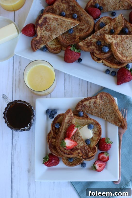 Overhead view of french toast with fruit- strawberries and blueberries.